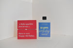 Bottle of letterbox cocktails with a happy birthday bracelet and personalised happy birthday cocktail on a white background
