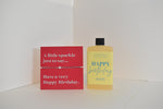 Bottle of letterbox cocktails with a happy birthday bracelet and personalised happy birthday cocktail on a white background