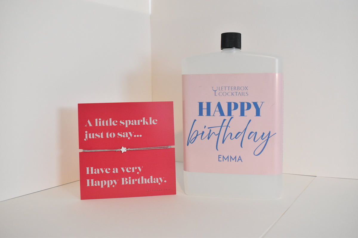 Bottle of letterbox cocktails with a happy birthday bracelet and personalised happy birthday cocktail on a white background