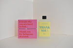 Bottle of letterbox cocktails with a pink thank you bracelet and personalised thank you cocktail on a white background