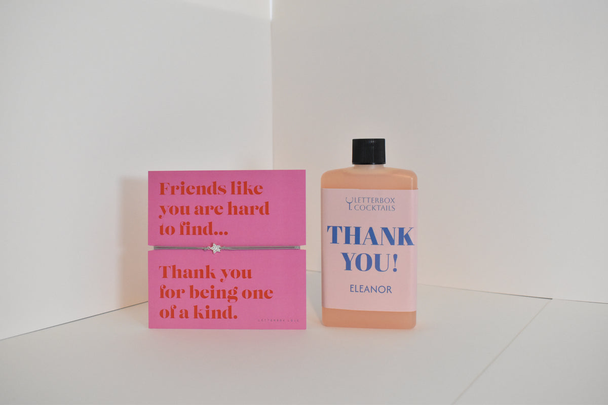 Bottle of letterbox cocktails with a pink thank you bracelet and thank you cocktail on a white background