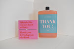 Bottle of letterbox cocktails with a pink thank you bracelet and personalised thank you cocktail on a white background