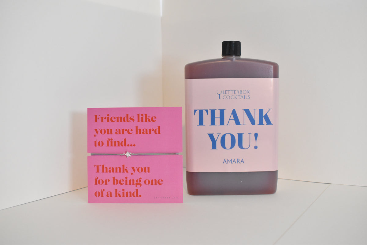 Bottle of letterbox cocktails with a pink thank you bracelet and personalised thank you cocktail on a white background