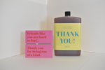 Bottle of letterbox cocktails with a pink thank you bracelet and personalised thank you cocktail on a white background