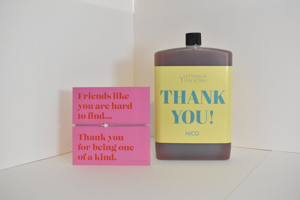 Bottle of letterbox cocktails with a pink thank you bracelet and personalised thank you cocktail on a white background